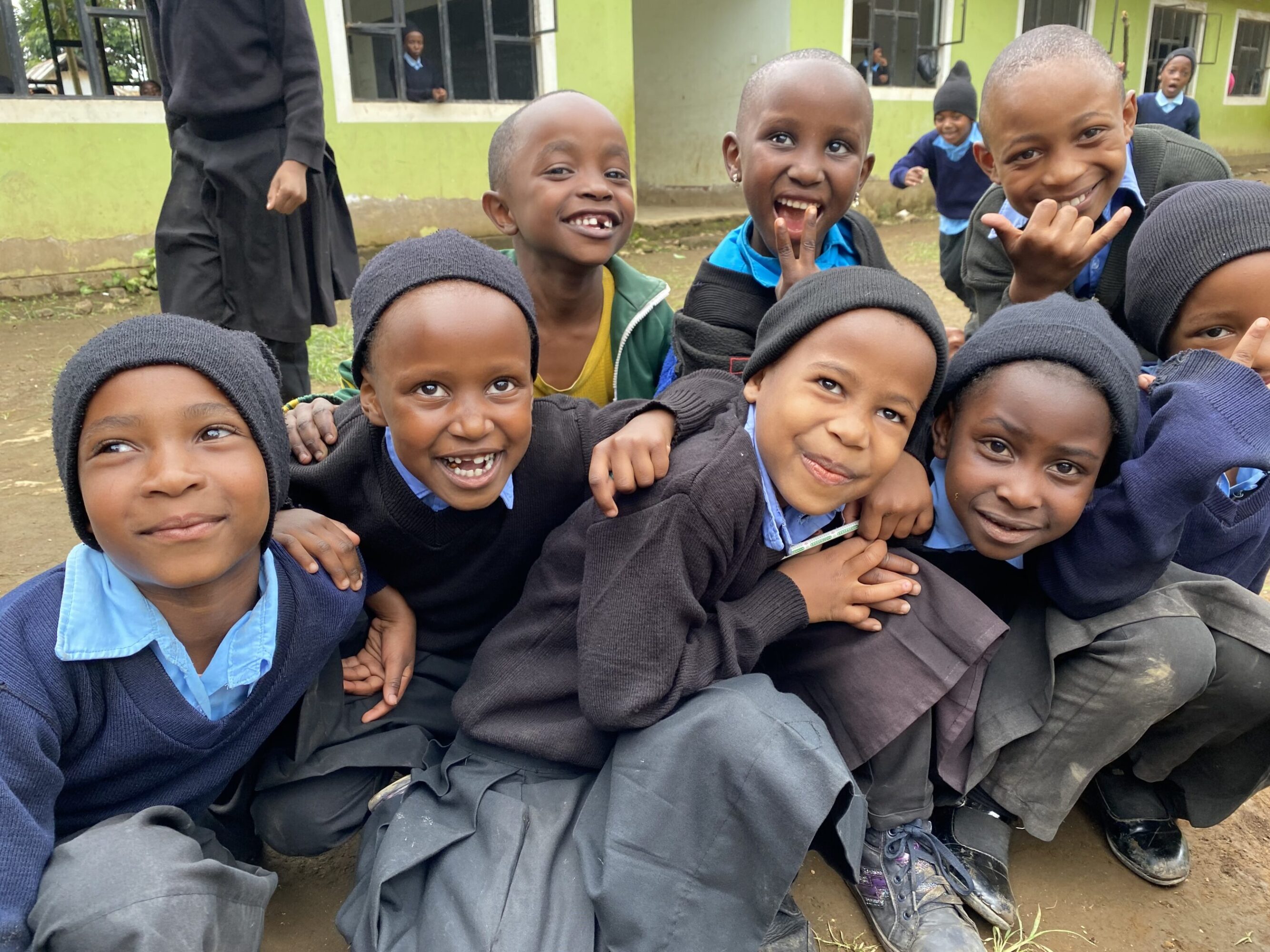 Group of children smiling for the camera.